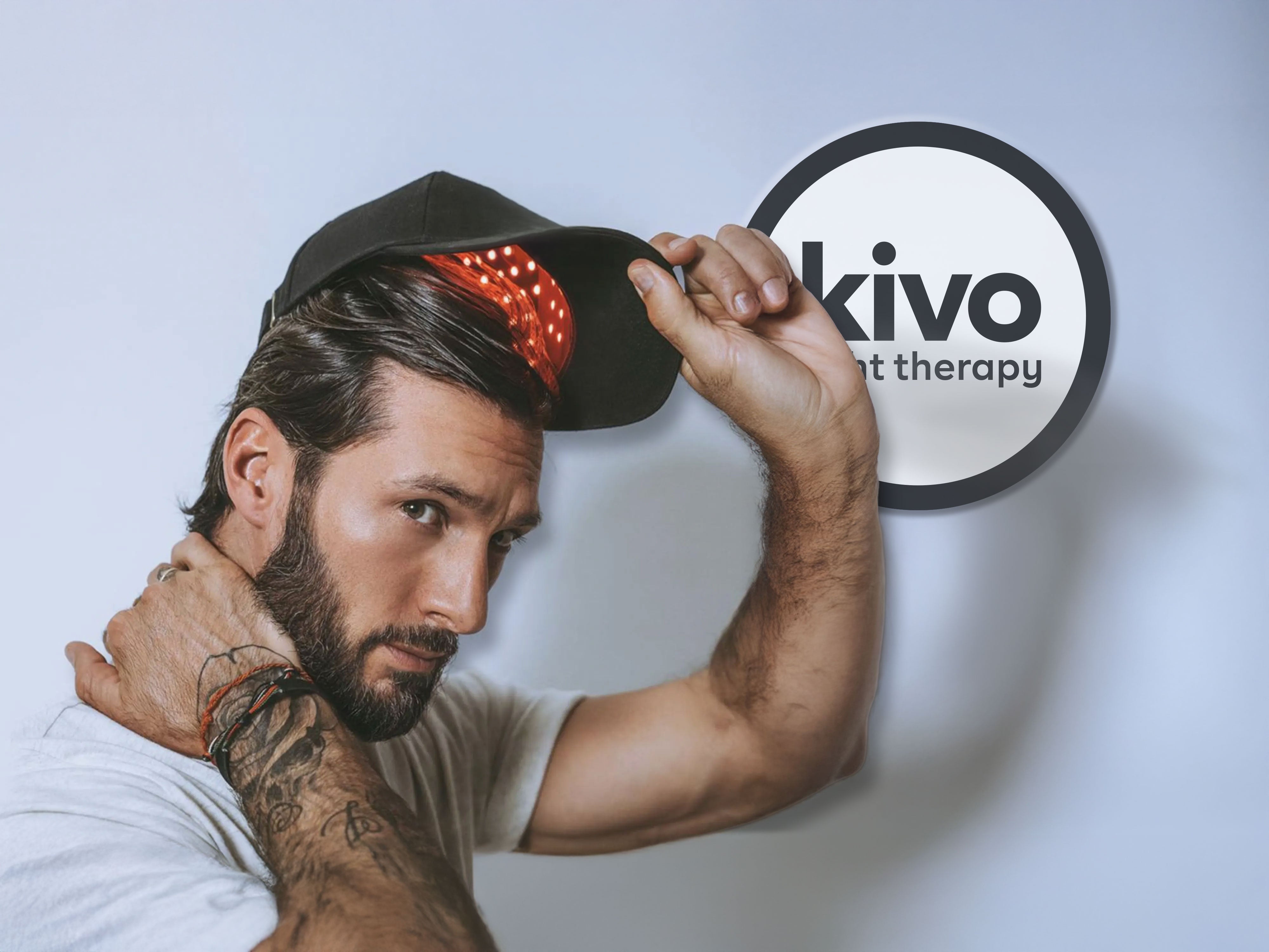 male wearing the kivo red light therapy cap